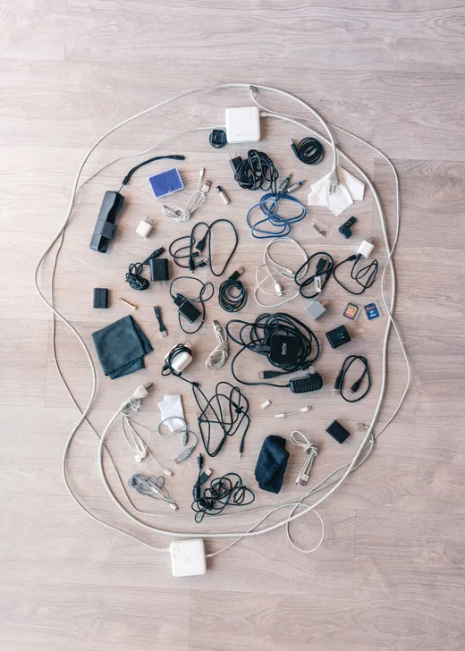 Assorted cables, chargers, and adapters laid out