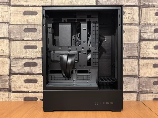 A desktop PC tower opened up on a workbench