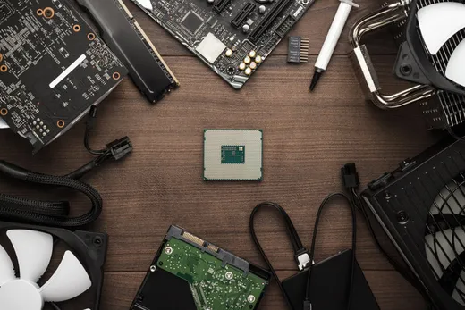 Assorted computer components laid out for reuse or parts recovery
