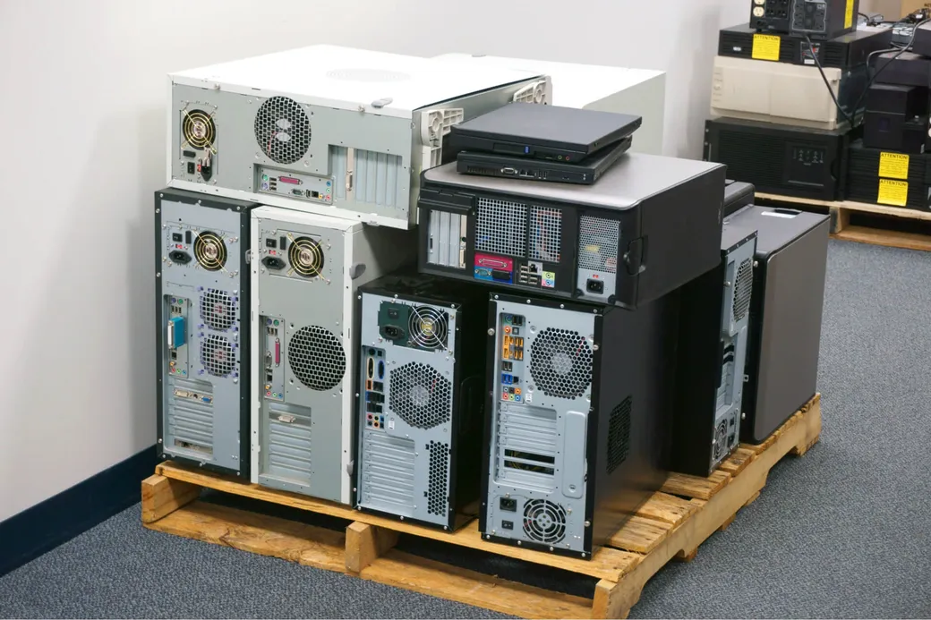 A batch of retired business desktop tower PCs cleared from an office